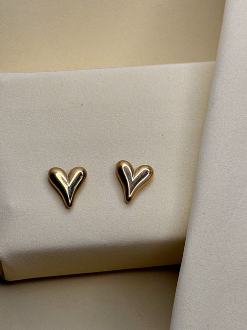 Heart Stud Earrings — sculpted gold-toned hearts with a hand-finished curve