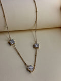 Midnight Ice Necklace — clear crystal stone suspended on a fine gold-toned chain