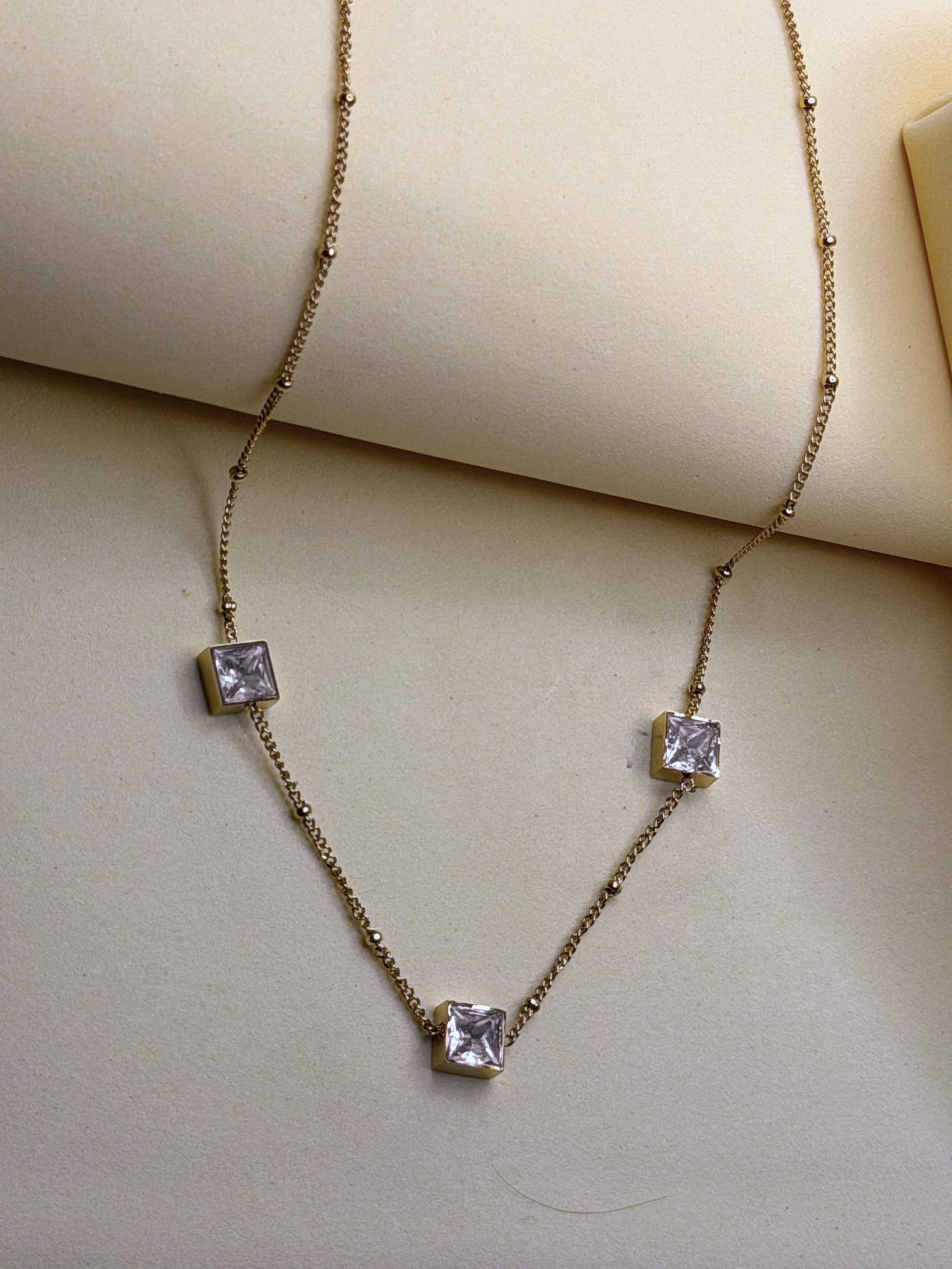 Midnight Ice Necklace shown at an angle, the crystal catching light