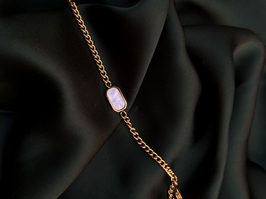 Noir Pearl White Bracelet on dark green silk