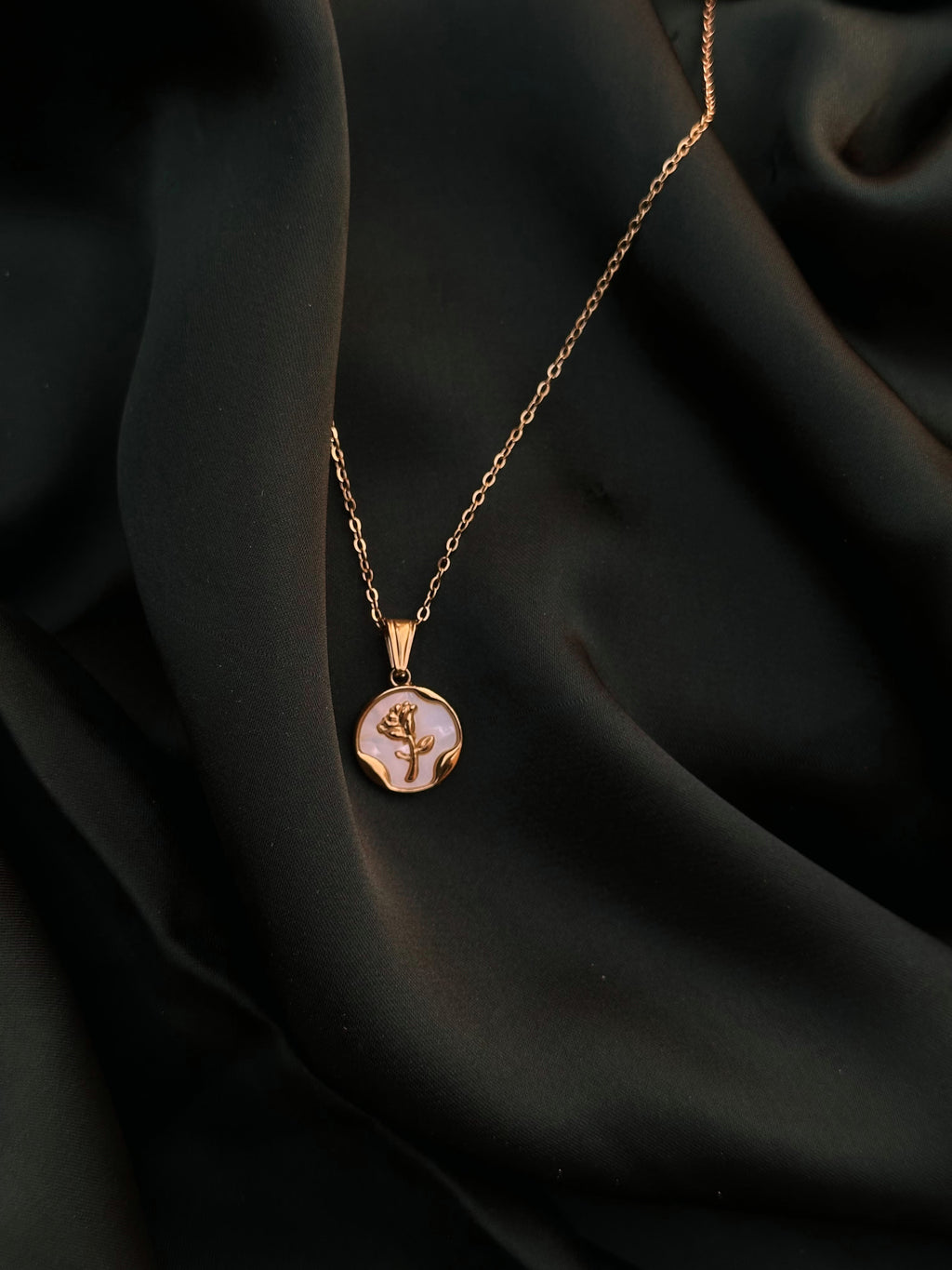 Pearl Coin Necklace on dark green silk