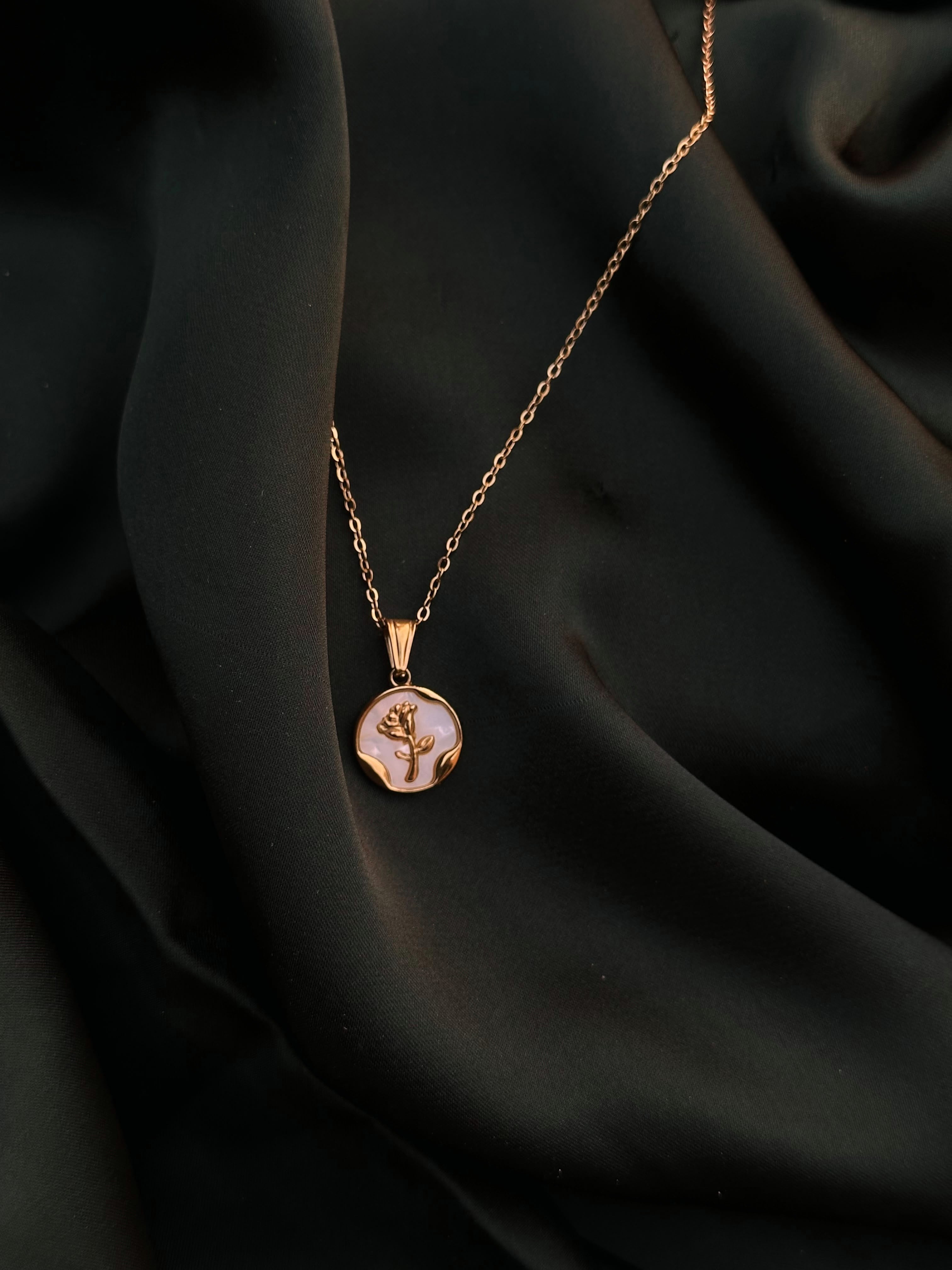 Pearl Coin Necklace on dark green silk
