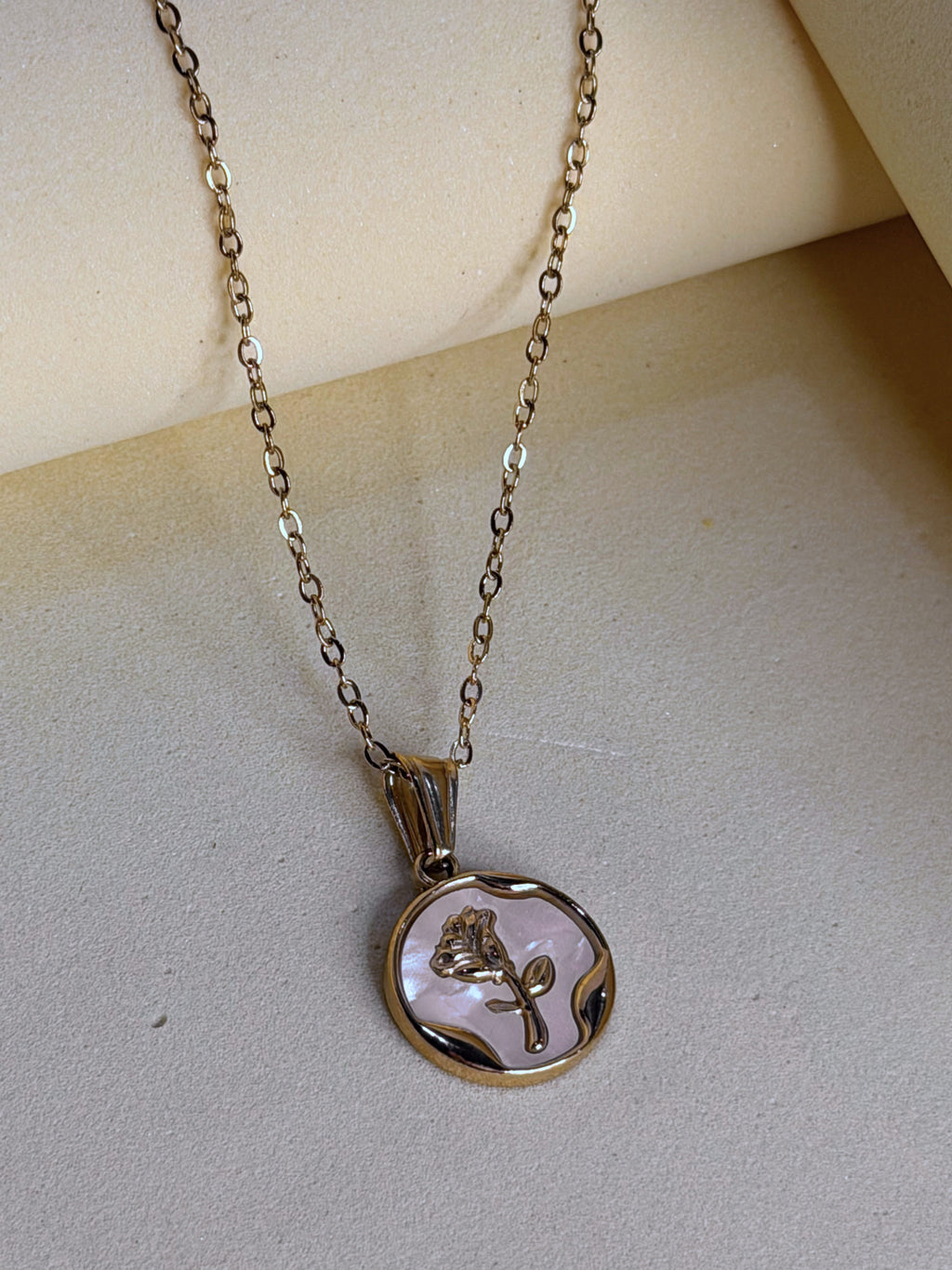 Pearl Coin Necklace shown close up, the mother-of-pearl catching light