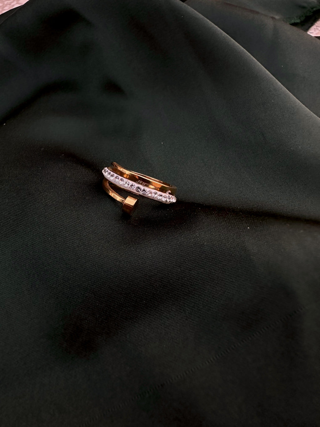 Triple Tier Orbit Ring with crystal row on dark green silk