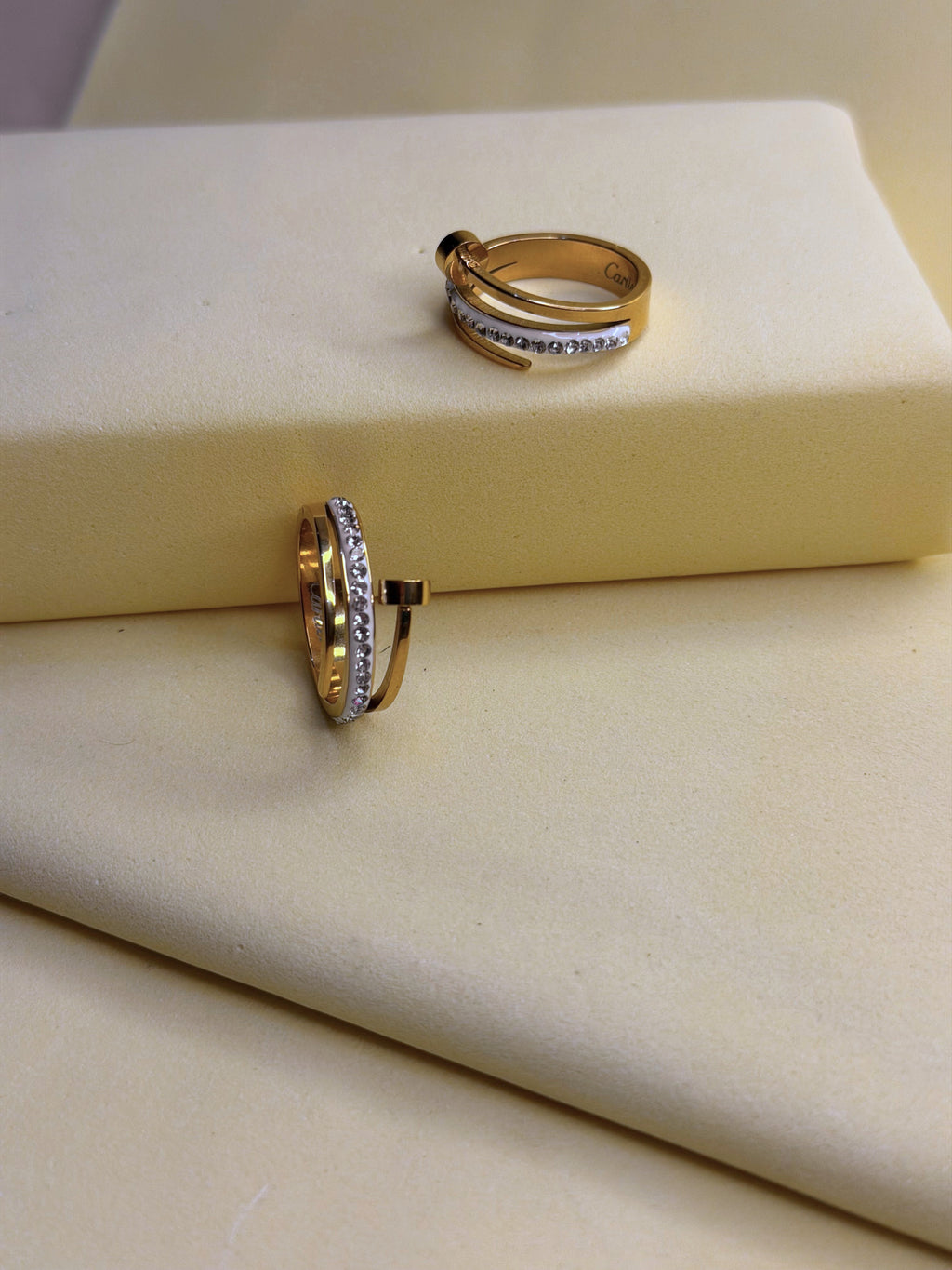 Triple Tier Orbit Ring — three slim gold-toned bands with a crystal-set row